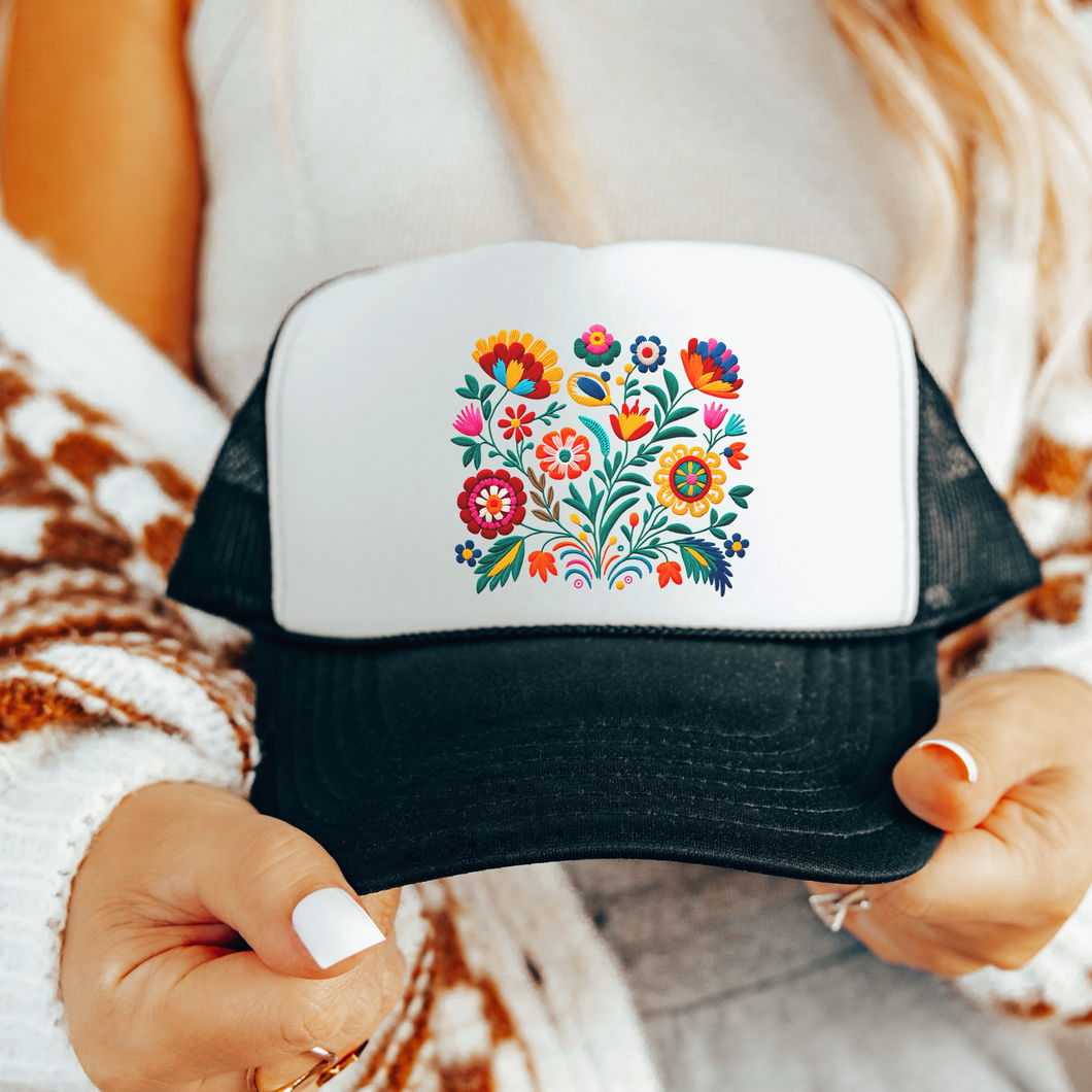White Foam and black mesh and bill trucker hat  with a color Mexican flower design 