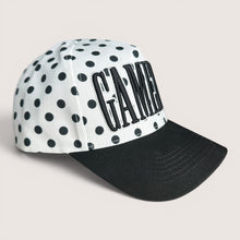 Load image into Gallery viewer, August Owl Gameday cap featuring a white base with black polka dots, black curved bill, and bold black puff lettering.