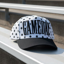 Load image into Gallery viewer, August Owl Gameday cap with black and white polka dot pattern and bold black puff embroidery on a curved black brim.