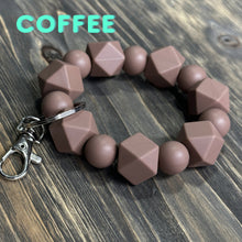 Load image into Gallery viewer, Large coffee colored Silicone keychain with hexagon and round silicone beads and silver hardware.