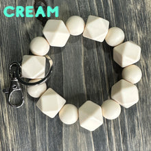 Load image into Gallery viewer, Large Cream Silicone keychain with hexagon and round silicone beads and silver hardware.