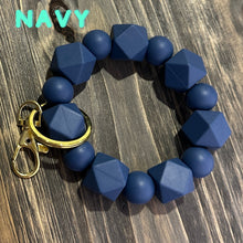 Load image into Gallery viewer, Large navy blue Silicone keychain with hexagon and round silicone beads and gold hardware.