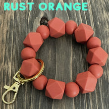 Load image into Gallery viewer, Large Rust Orange Silicone keychain with hexagon and round silicone beads and gold hardware.