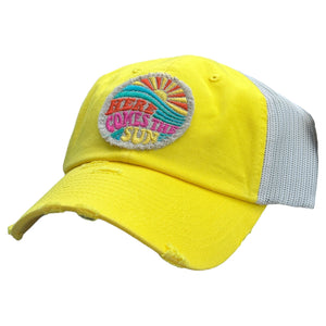 vibrant yellow low profile and unstructured trucker hat with a frayed embroidered patch that says, here comes the sun.