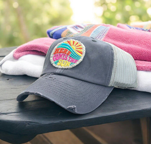 Gray and Ivory Mesh low profile and unstructured trucker hat with a frayed embroidered patch that says, here comes the sun.