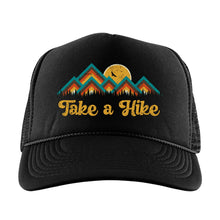 Load image into Gallery viewer, Black high profile foam trucker hat with a colorful mountain image with the words, Take a Hike in yellow retro font