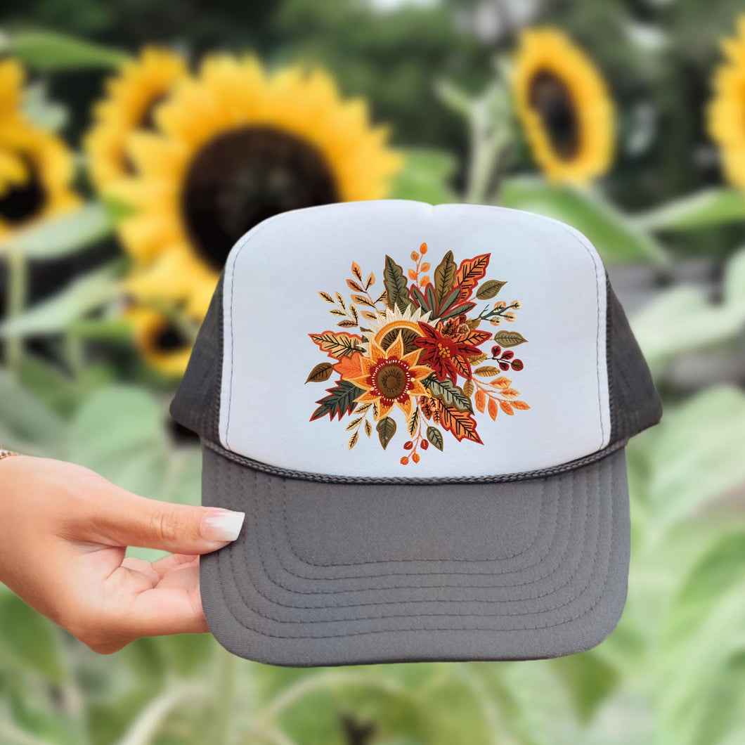 fall boho floral design, multi colored, printed on a charcoal gray trucker hat with white front.