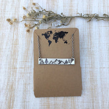 Load image into Gallery viewer, Silver hand stamped bar necklace with mountains and pine trees