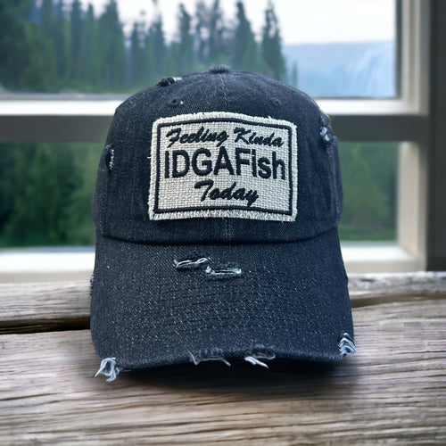 A black denim dad hat with a fabric Feeling Kinda IDGAFish Today Patch. The hat is slightly distressed.