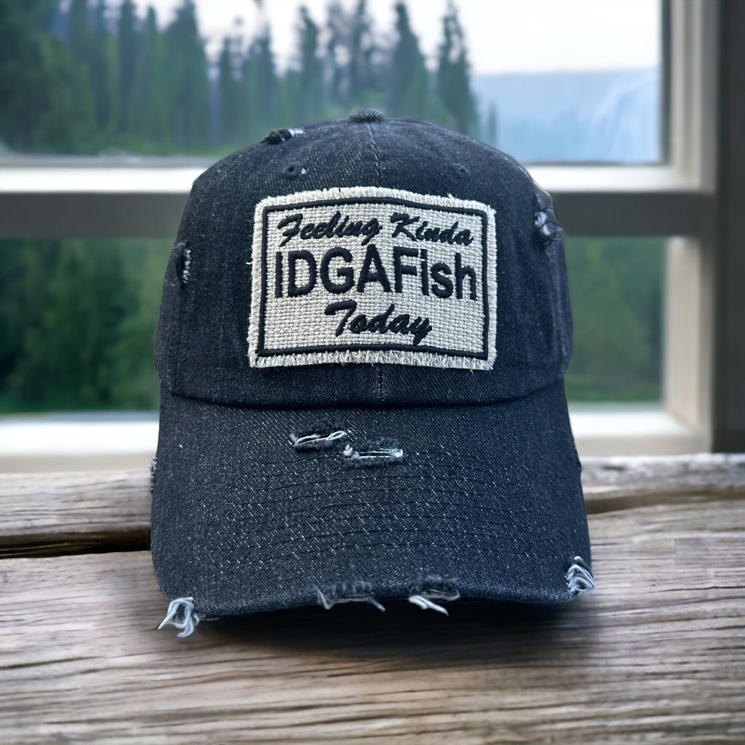 A black denim dad hat with a fabric Feeling Kinda IDGAFish Today Patch. The hat is slightly distressed.