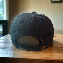 Load image into Gallery viewer, A picture of back of the dad hat with a metal loop closure for easy adjusting