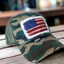 Load image into Gallery viewer, Camo, Low profile, unstructured, mesh trucker hat with a distressed fabric Vintage inspired United States Flag