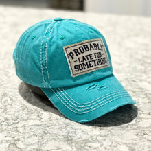 Load image into Gallery viewer, Turquoise vintage washed.baseball cap with white stitching. It has a hand-frayed rectangle patch(3.5x2.3 in) with the words, &quot;Probably Late for Something.&quot;