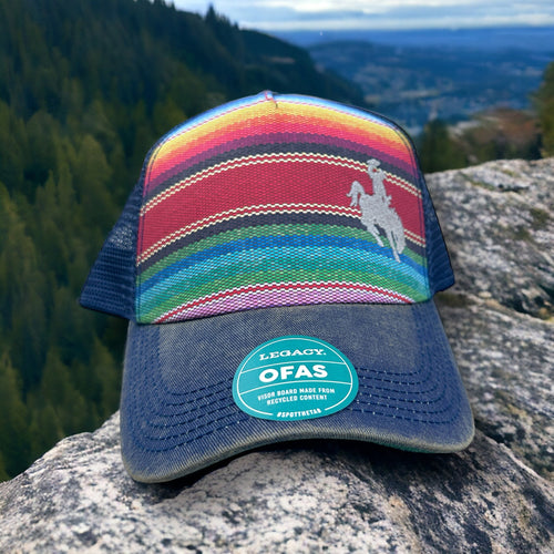 Western colorful striped trucker hat with bucking horse and cowboy embroidered on the right front side.